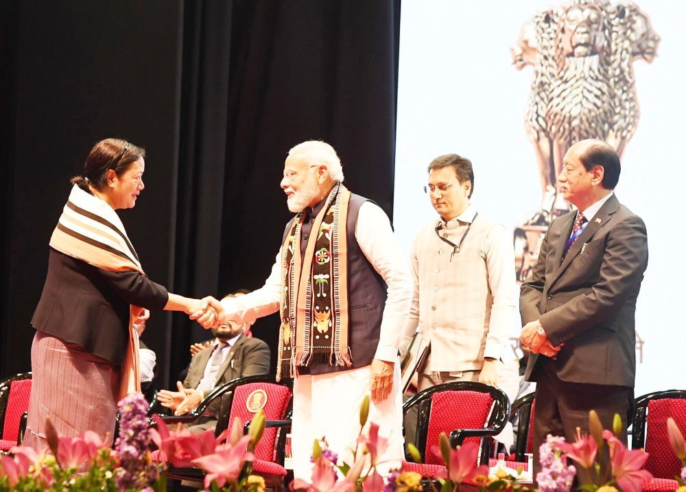 Salhoutuonuo Kruse shakes hands with Prime Minister Narendra Modi during the swearing-in of the new Government of Nagaland in Kohima on March 7. (PIB Photo)
